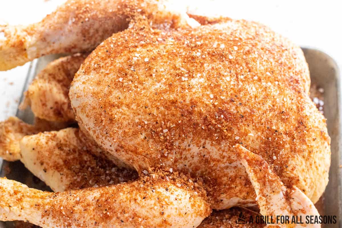 whole chicken coated with rub