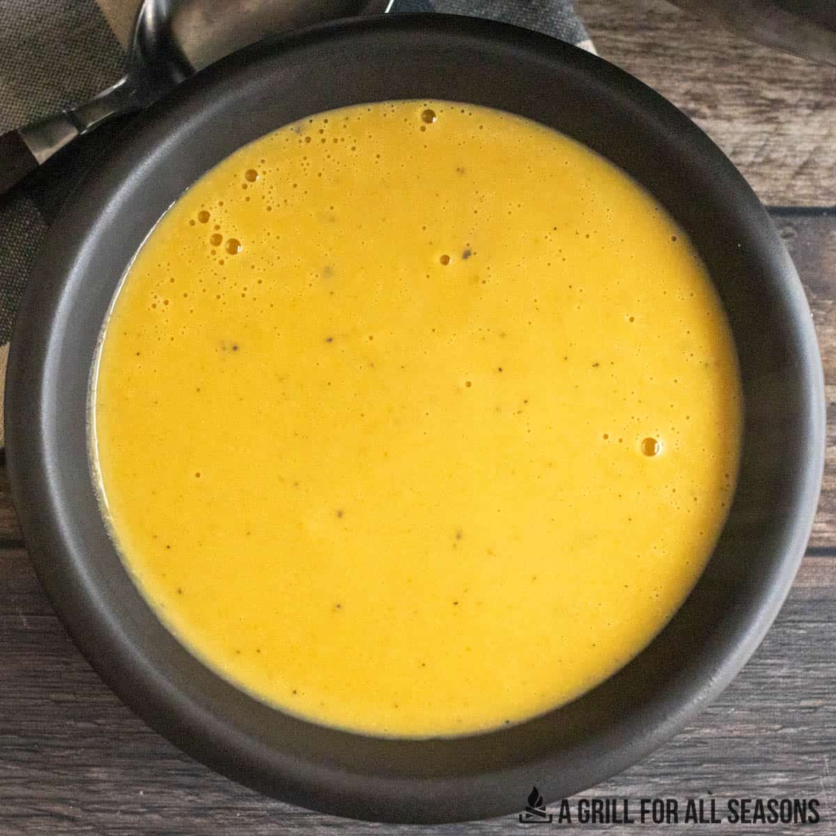 overhead shot of bowl of 3 ingredient butternut squash soup made with smoked butternut squash