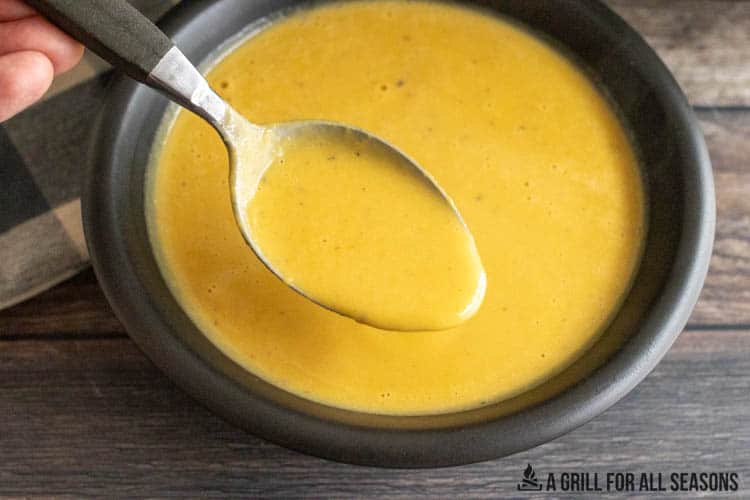 spoon lifting a bite of 3 ingredient butternut squash soup