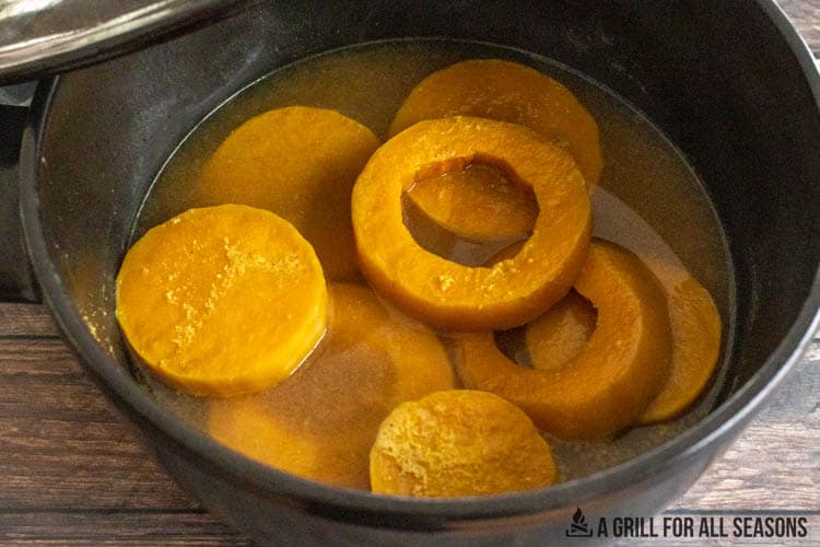 rings of smoked butternut squash in broth