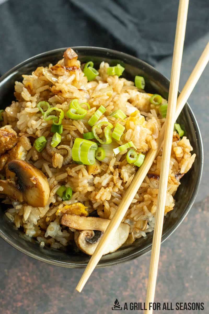fried rice in bowl with chopsticks