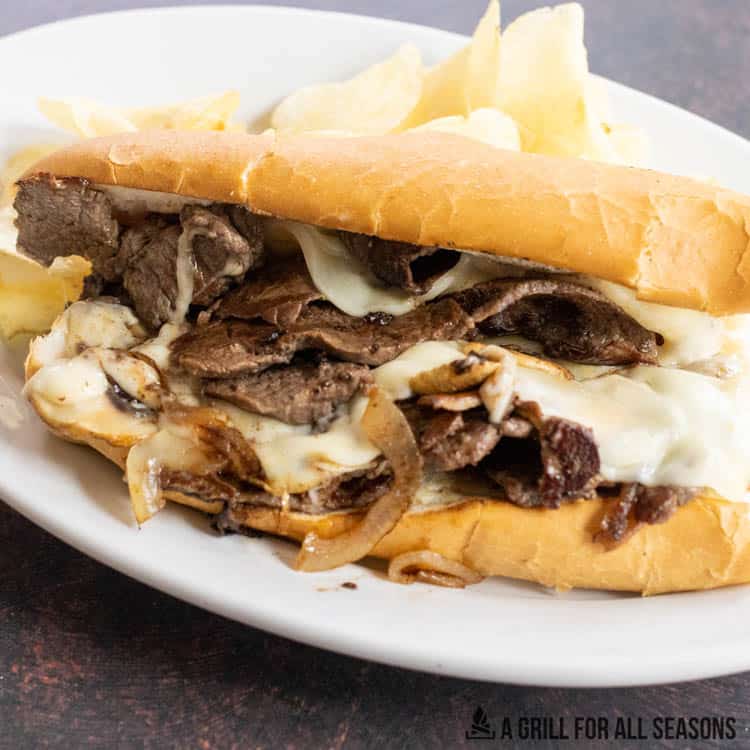 blackstone cooked philly cheesesteak on white plate