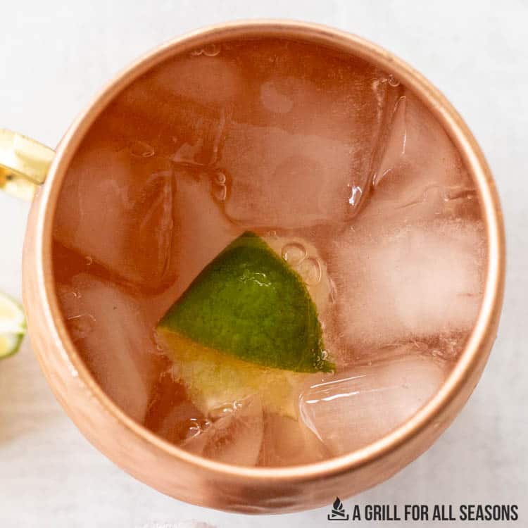 overhead shot of moscow mule with rum garnished with lime
