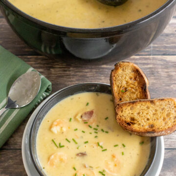 bowl of shrimp and corn bisque with toasted bread