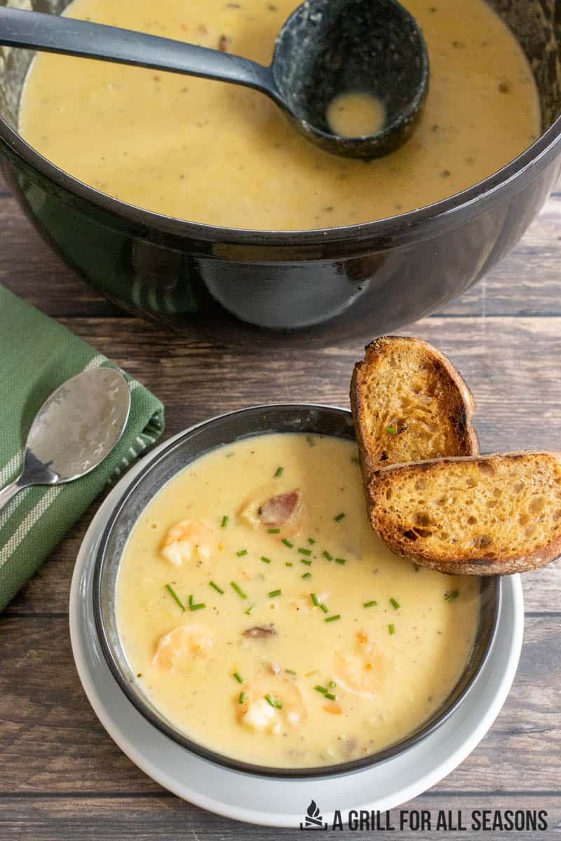 bowl of shrimp and corn bisque with toasted bread