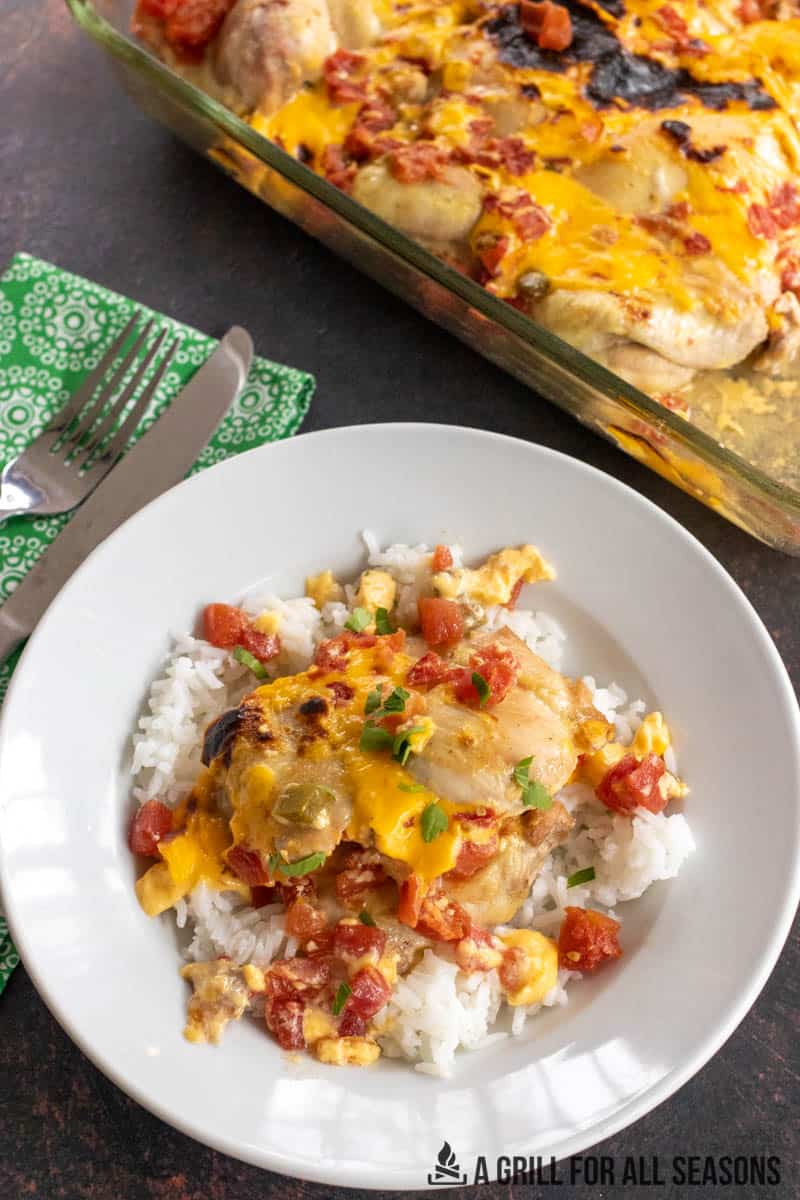casserole dish of queso chicken and plate with served portion