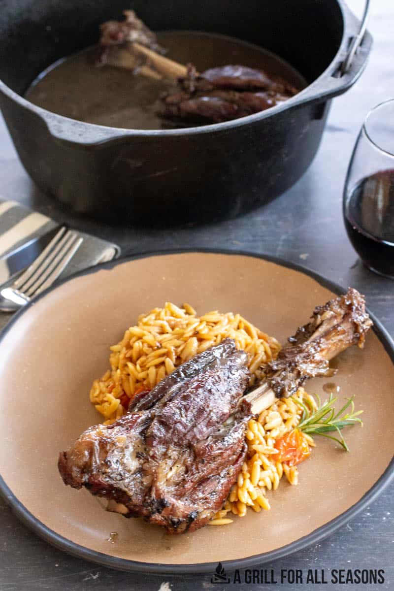 smoked lamb shank plated with orzo
