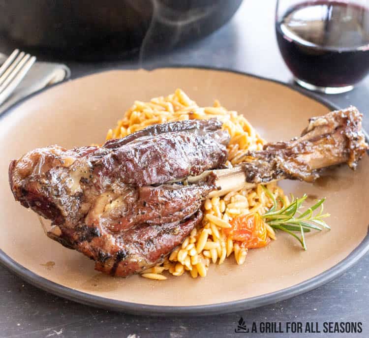 smoked lambshank on plate with orzo