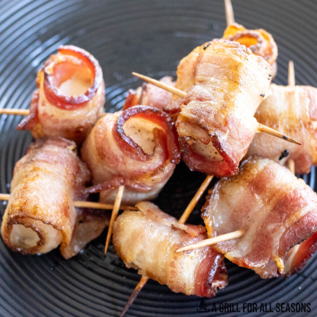 Bacon wrapped cod appetizers on dish