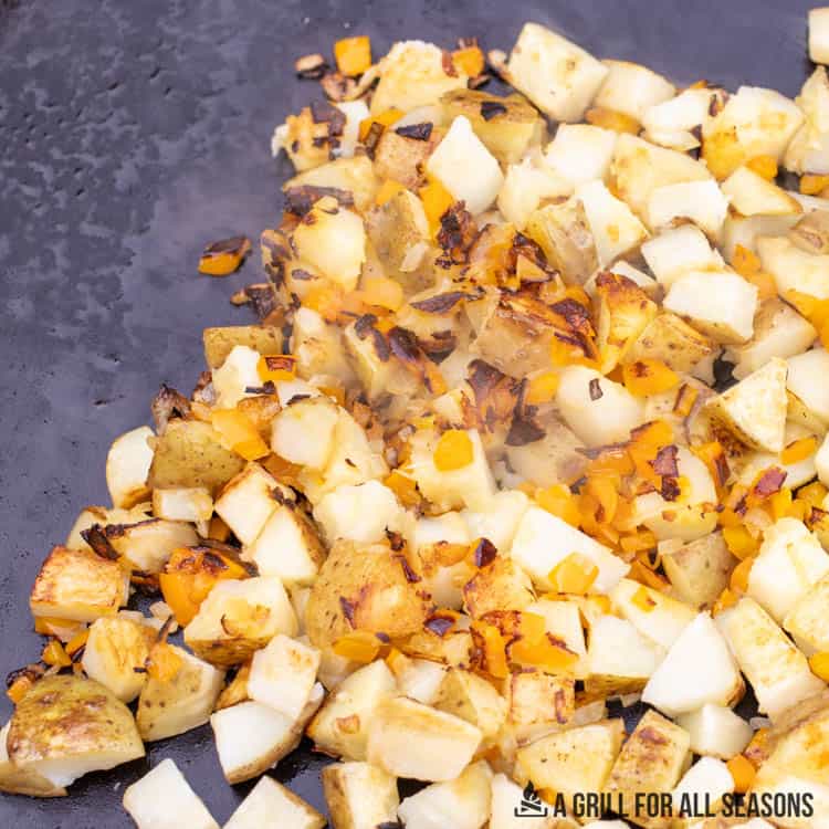 chopped potatoes on blackstone griddle