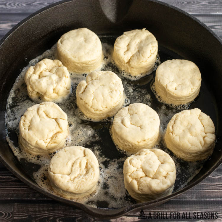biscuits cooking in cast iron pan