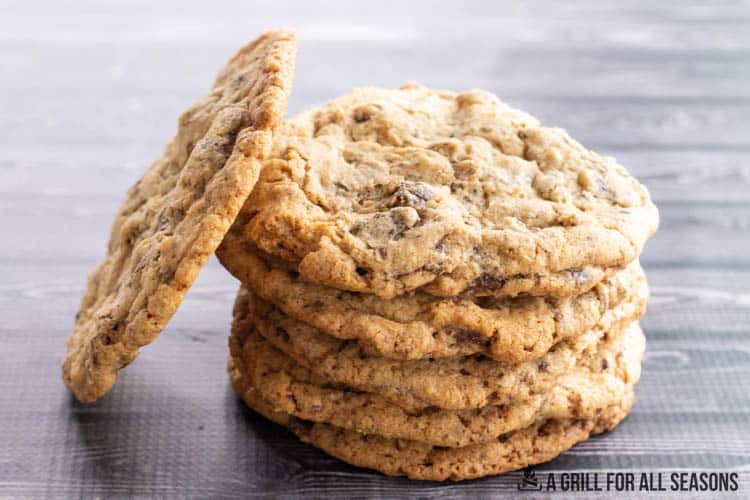 stack of smoked chocolate chip cookies with one leaning on the stack