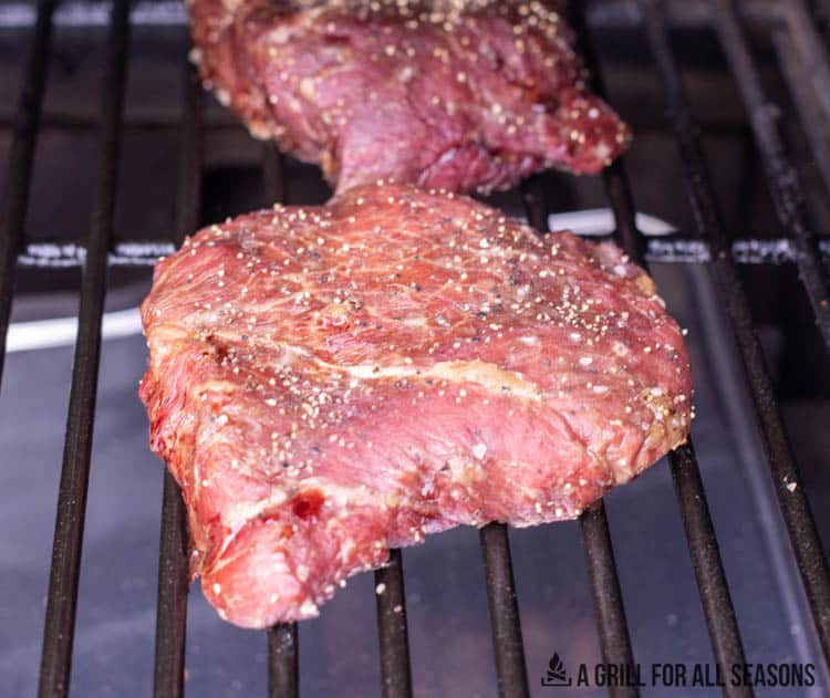 smoked flat iron steak on traeger grill grates