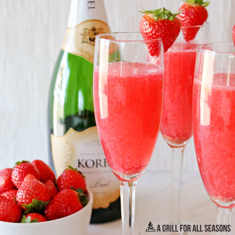 champagne glasses with the strawberry mimosa recipe