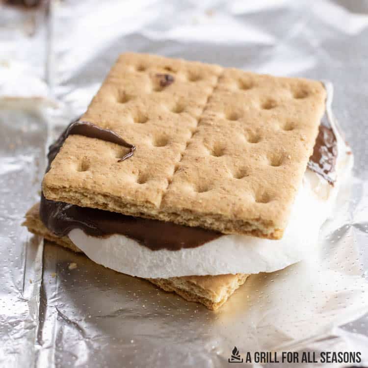 melted marshmallow and chocolate between two graham cracker halves