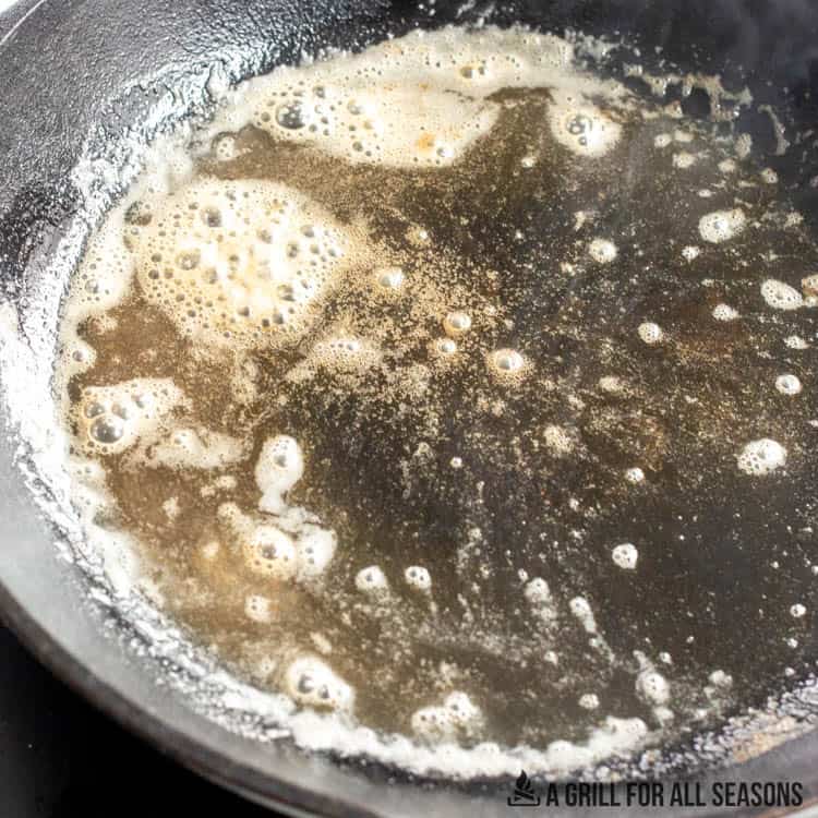 melted butter in cast-iron pan