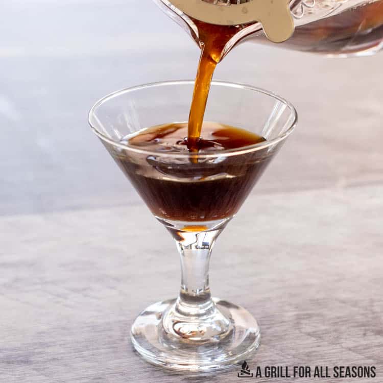 creamy espresso martini being poured into glass
