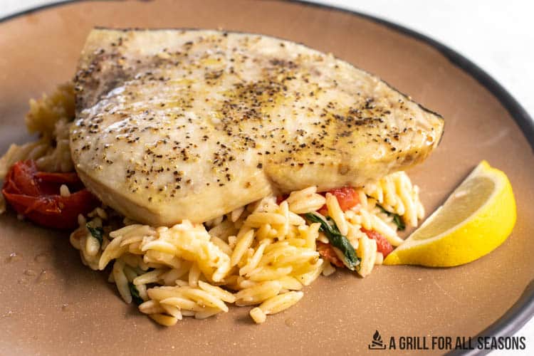 orzo plated with fish