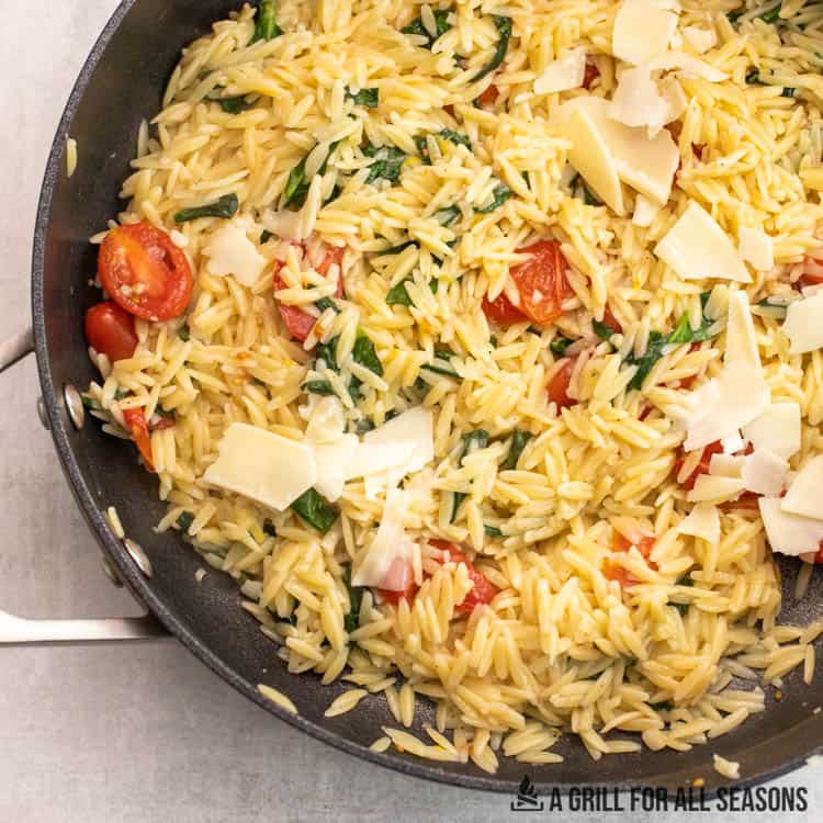 lemon orzo with spinach in skillet