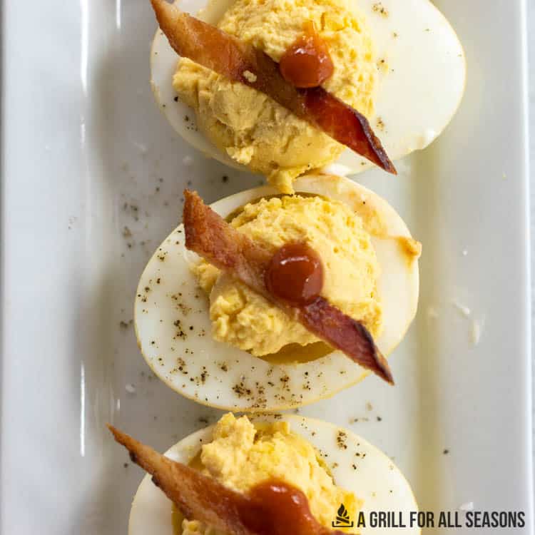 smoked eggs made into smoked deviled eggs with bacon