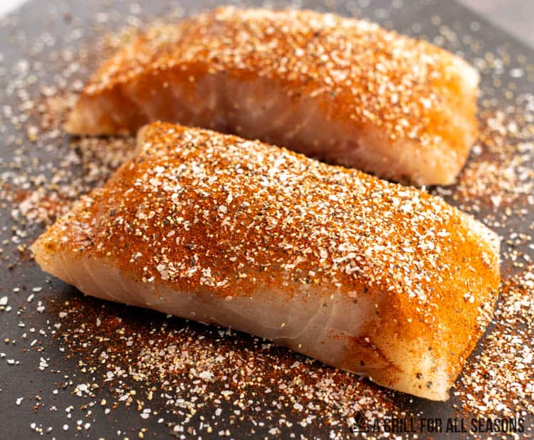 seasoned pieces of fish on table