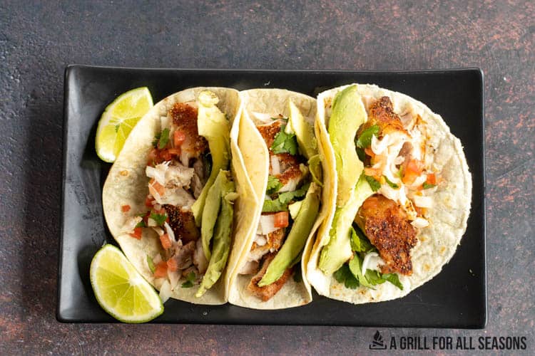 3 fish tacos on plate, over head view