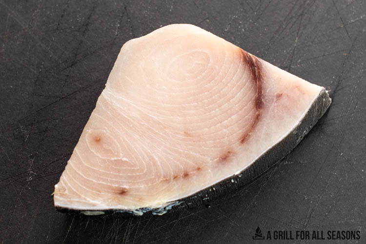 raw fish on cutting board