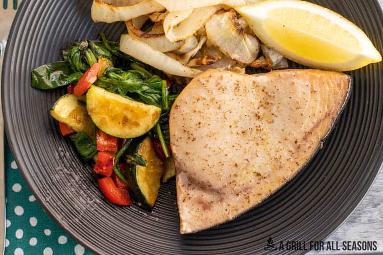 smoked swordfish on plate with lemon