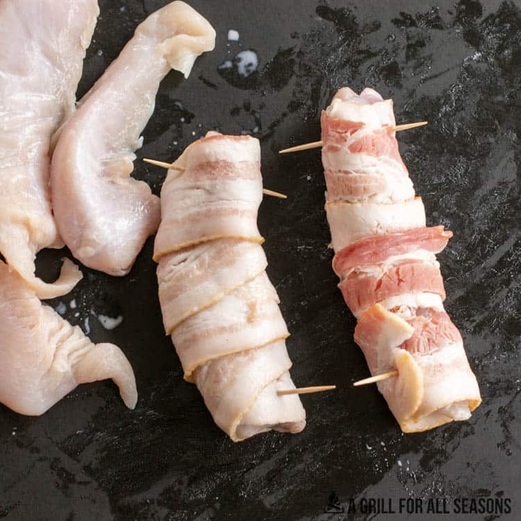 process shot showing alligator tenderloins being wrapped in bacon