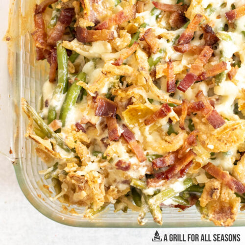 close up of loaded green bean casserole recipe with cream cheese in baking dish