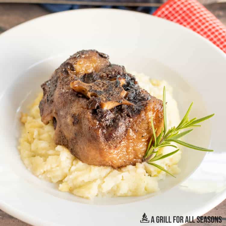 smoked oxtail recipe served on a bed of mashed potatoes from overhead