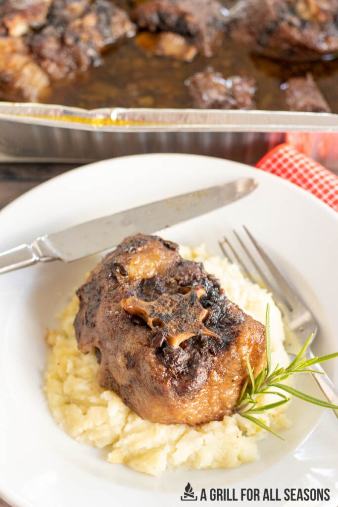 smoked oxtail recipe served on a bed of mashed potatoes