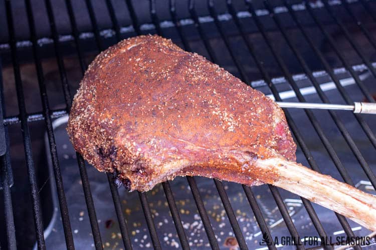 tomahawk steak on traeger pellet grill smoker