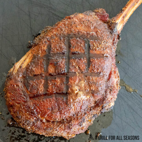 smoked tomahawk steak with grill lines