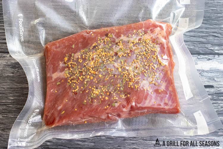 beef and seasoning in vacuum sealed bag