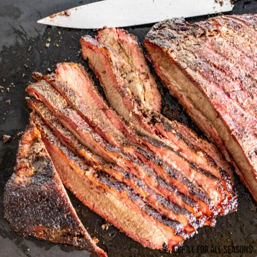 smoked brisket flat recipe shown with sliced meat on cutting board
