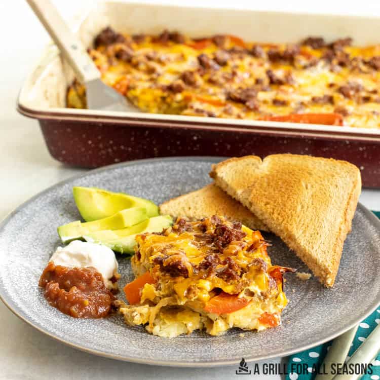 chorizo casserole recipe with eggs and hashbrown potatoes served on plate with toast