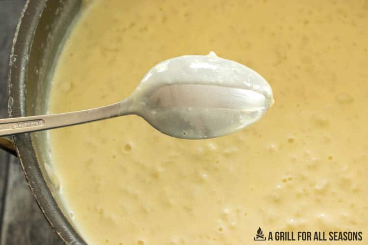 thickened custard shown on spoon