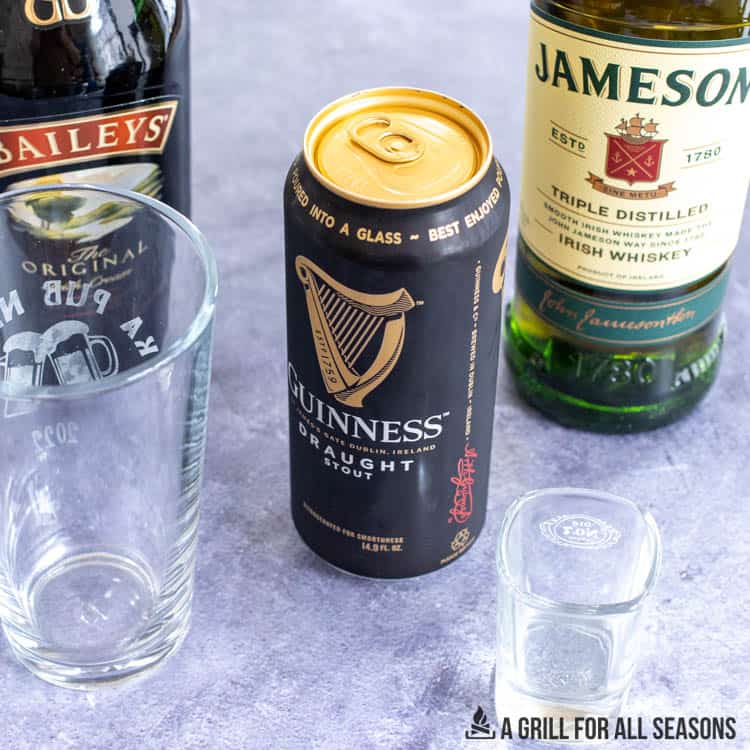 can of guiness, bottle of jameson, and bottle of baileys.