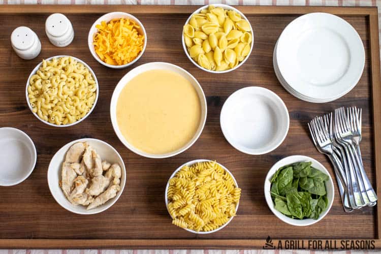mac and cheese mix-in options on charcuterie board