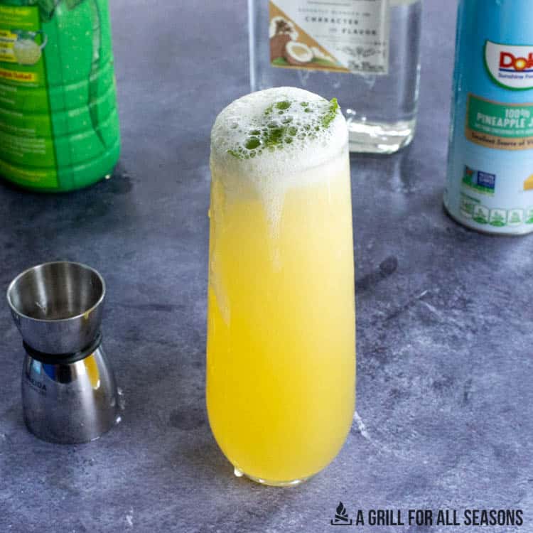 tall glass with tropical mojito recipe