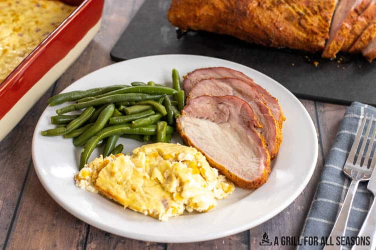 corn casserole recipe served with green beans and pork loin