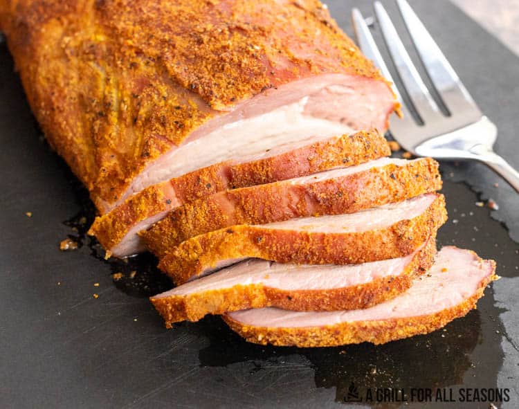 pork roast sliced on cutting board