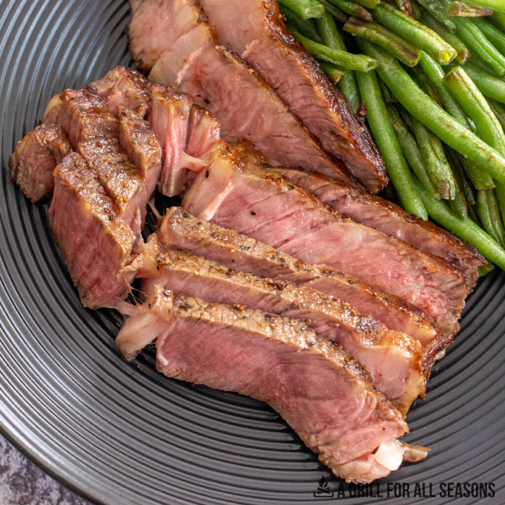 steak plated with greenbeans