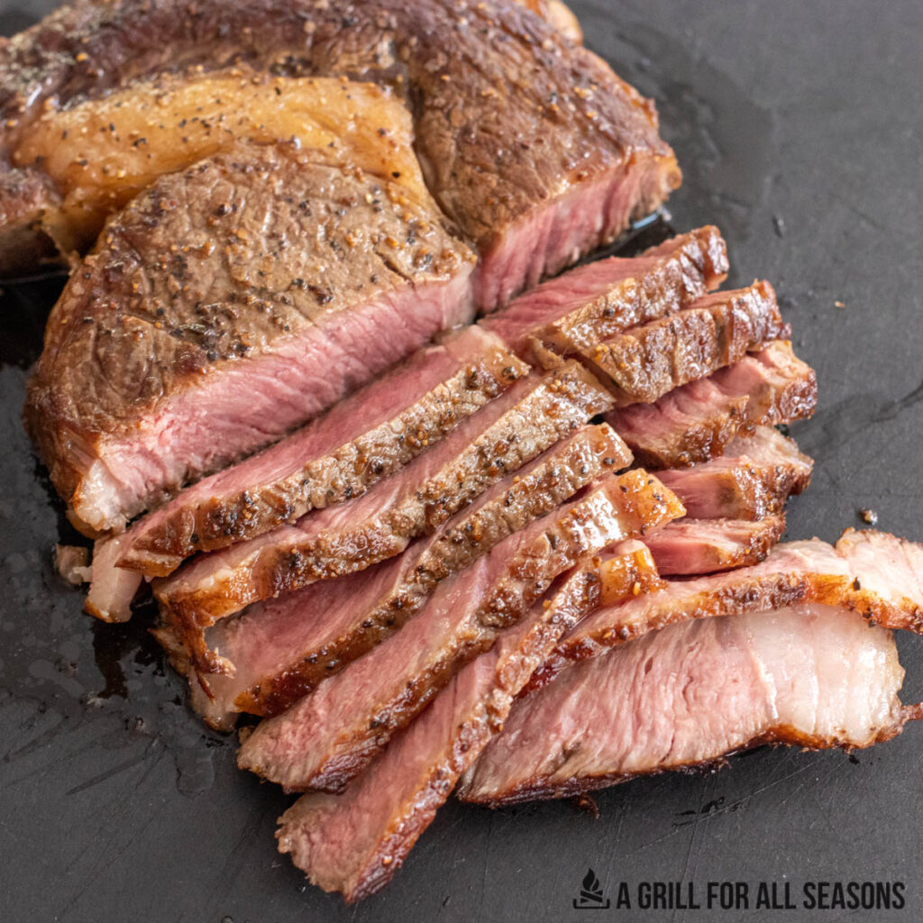 steak sliced on cutting board
