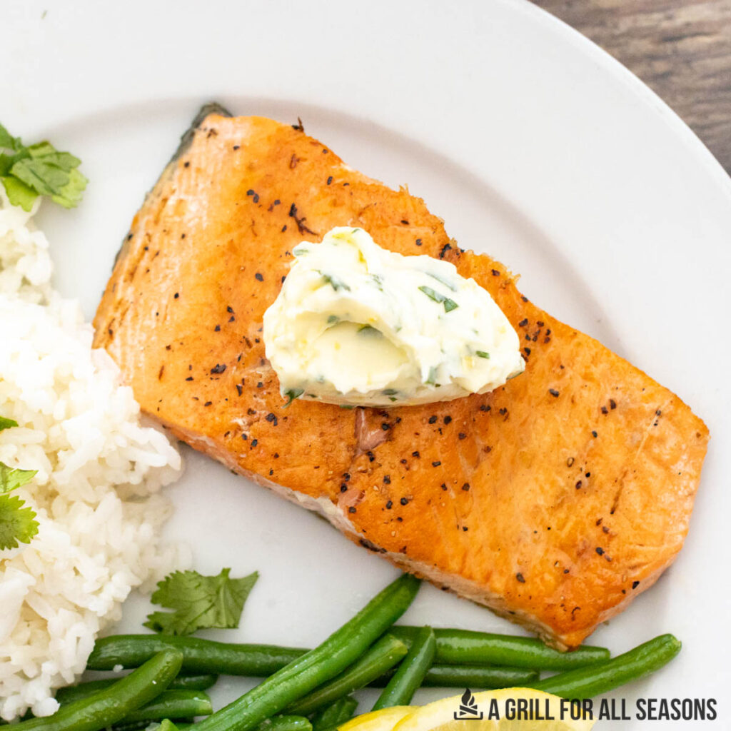 salmon served with herb butter
