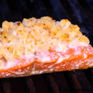 grilled salmon stuffed with shrimp shown close up on grill