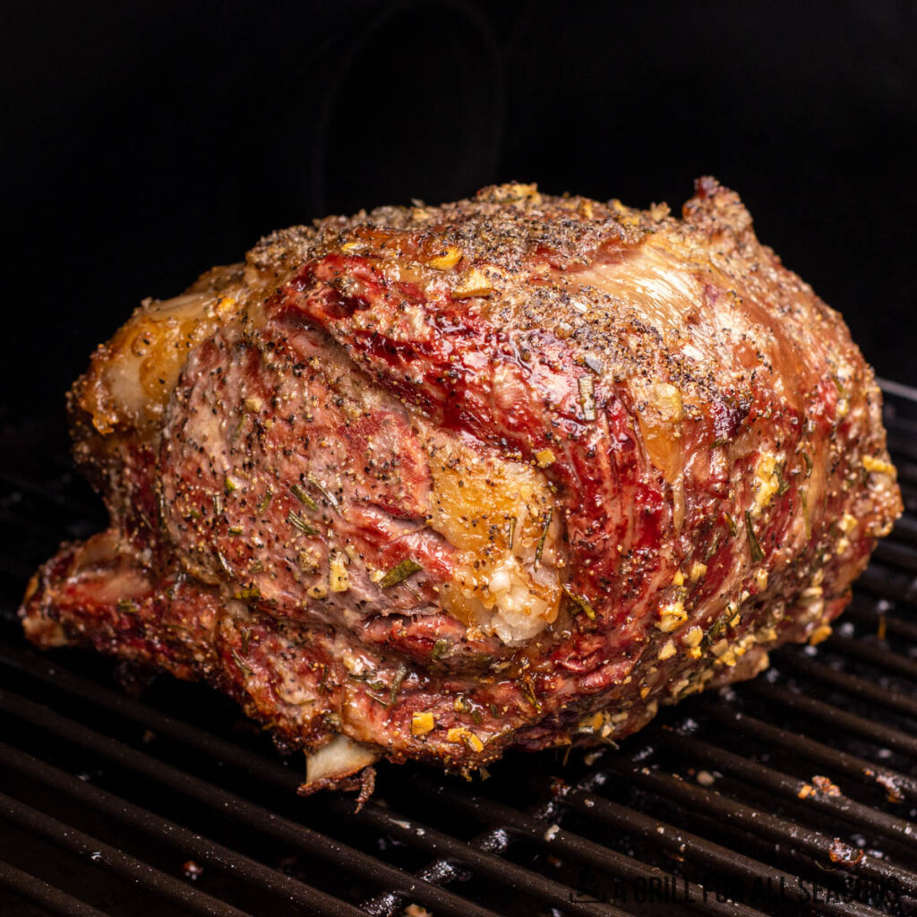 smoked prime rib roast from side in smoker