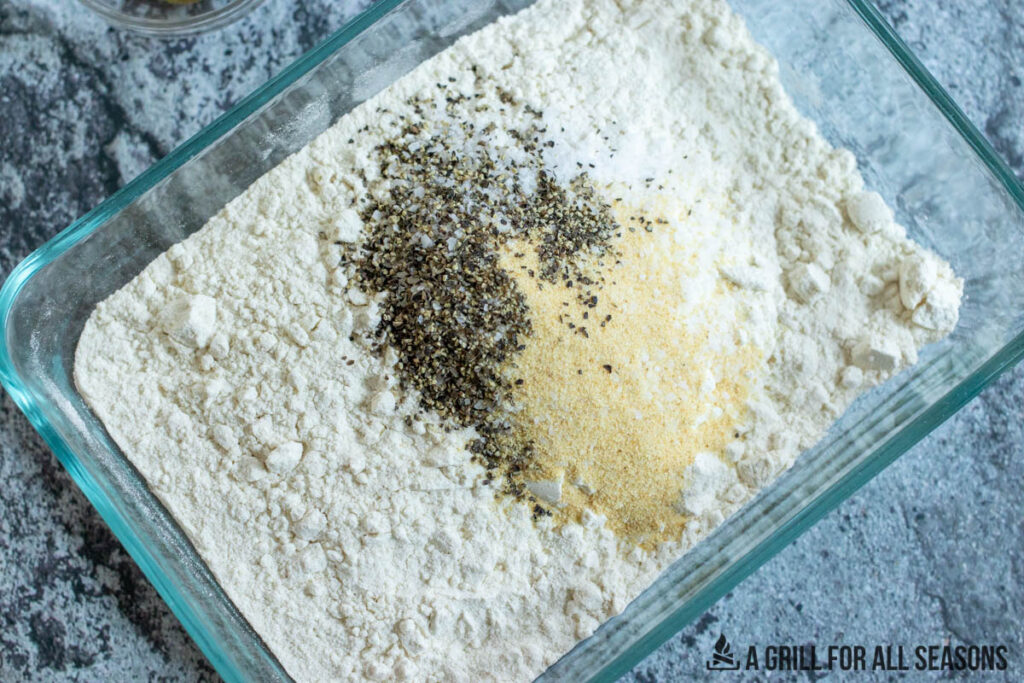 flour with seasoning in glass dish