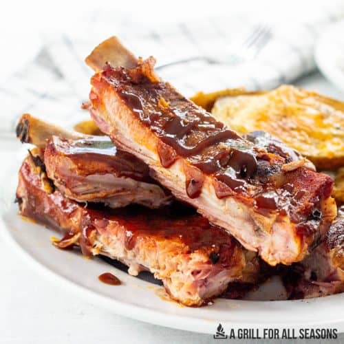 pellet grill ribs recipe served on a plate with potatoes